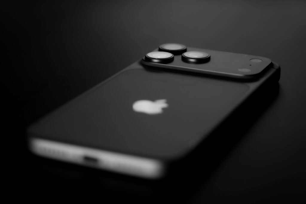 Black smartphone with three camera lenses on back